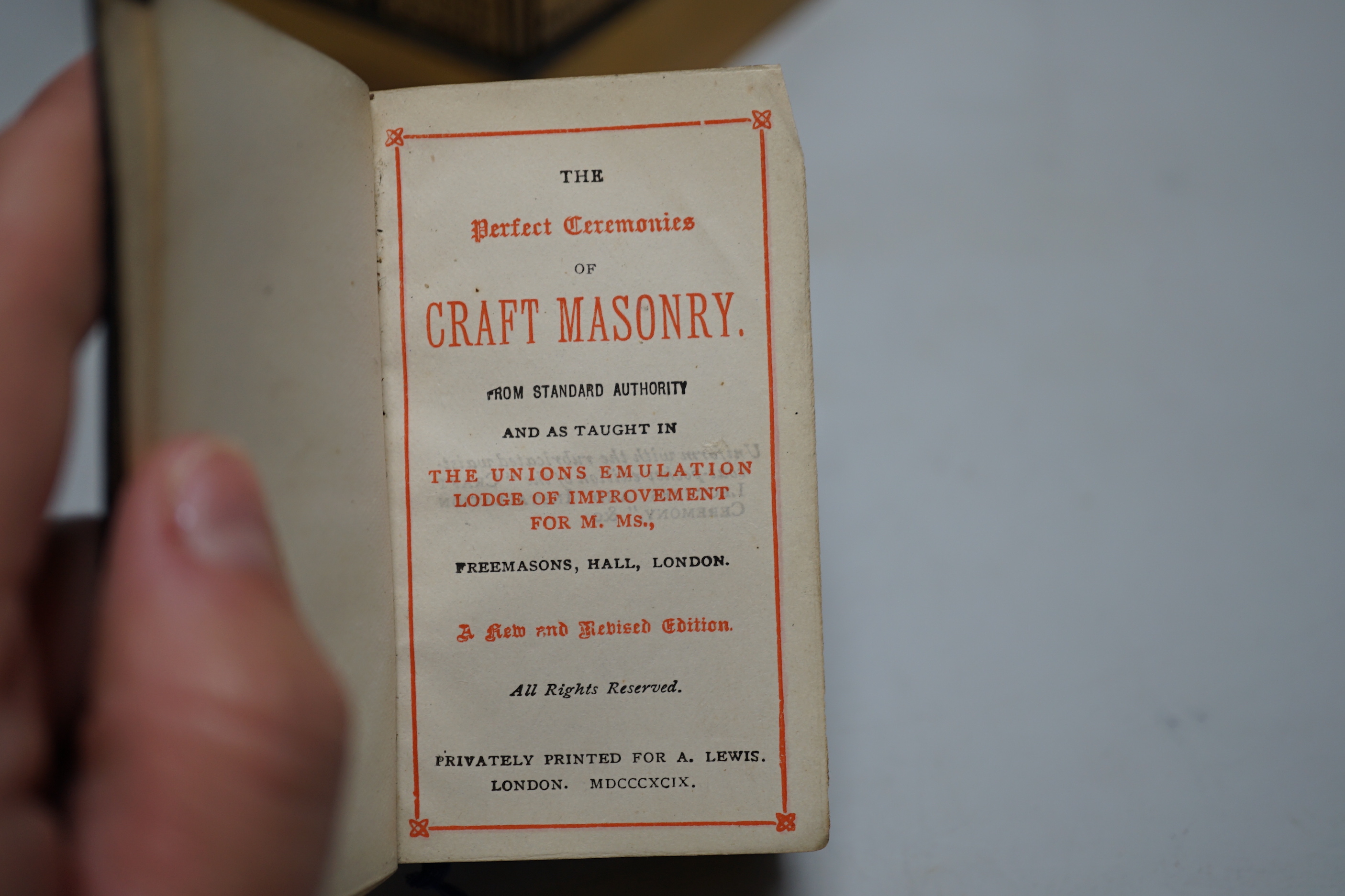 A German astrological cast stand together with a Masonic ceremony book, tallest 23cm